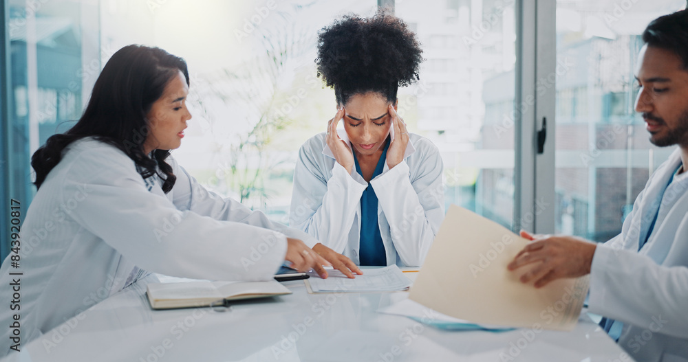 Fototapeta premium Headache, doctors or woman with stress in meeting, hospital or clinic overwhelmed by emergency deadlines. Anxiety, burnout or frustrated healthcare surgeon with migraine pain, documents or paperwork