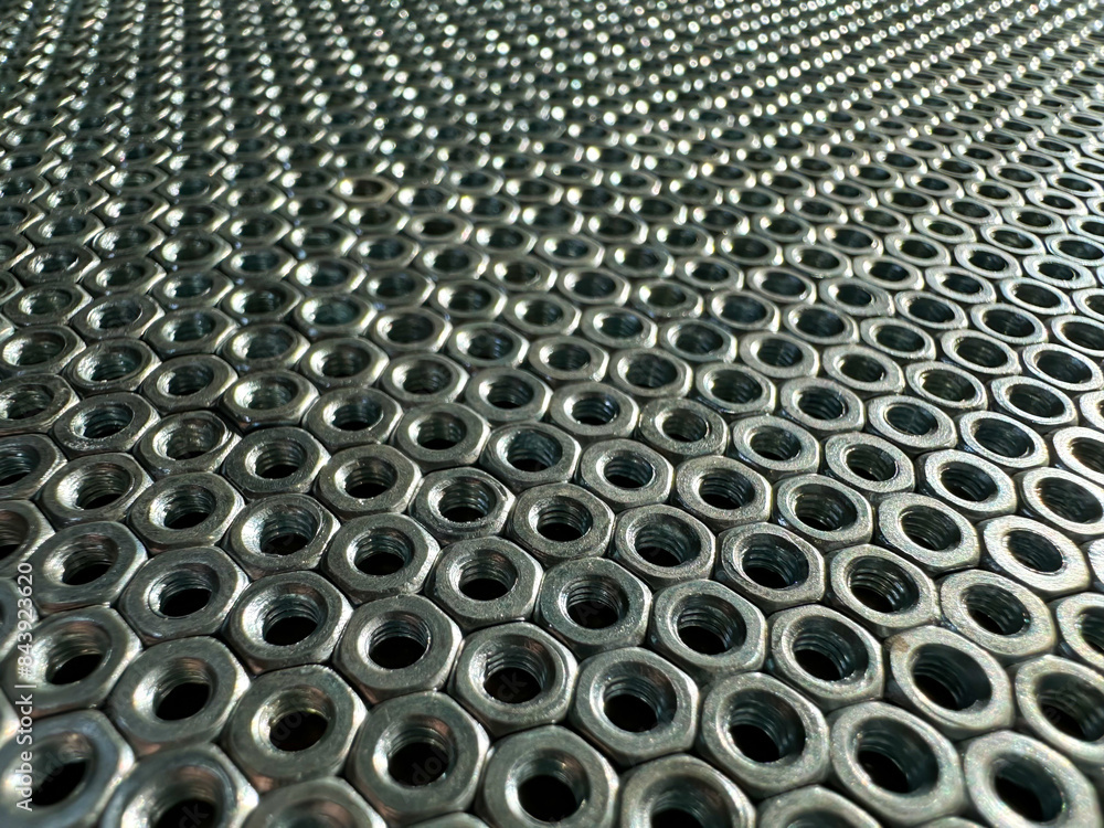 Nuts are arranged in a pile on a metallic surface Nuts are arranged in a pile on a metallic surface