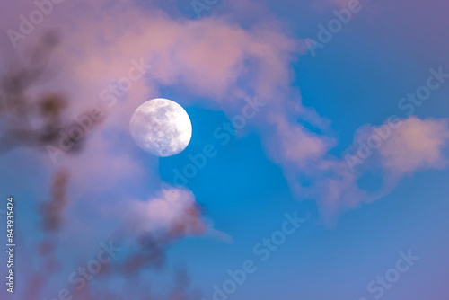 Photography A full moon and clouds during Sunset