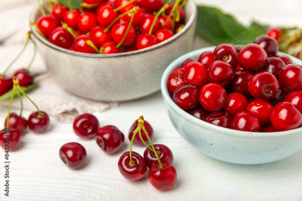 Cherries. Fresh ripe cherries with leaves on a textured wooden background. Fresh sweet organic cherry pile. Berries and fruits. Vegan. Healthy eating. Place for text. Copy space Cherries. Fresh ripe cherries with leaves on a textured wooden background. Fresh sweet organic cherry pile. Berries and fruits. Vegan. Healthy eating. Place for text. Copy space
