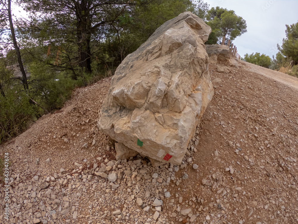 Rocky hiking path in mountain range Massif des Calanques near Cassis at the French Riviera, France. Walking trail near Calanque d'en vau.
