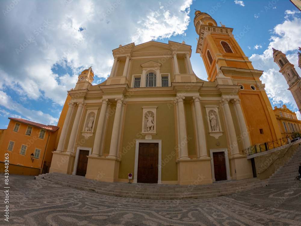 The Basilica of Saint-Michael the Archangel in Menton, France. The tall bell tower on the right side of the church was added at the beginning of the 18th century.