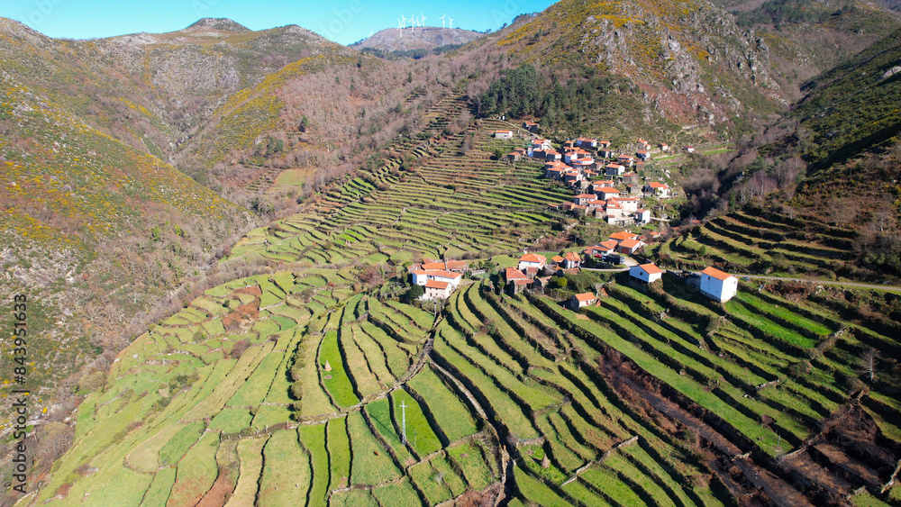 Aerial view of Porta Cova place in Sistelo, Portugal. The green agricultural terraces where the locals plant their crops and graze their cattle has earned it the nickname of “Little Portuguese Tibet”.