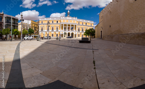 Badajoz, Spain, September 10, 2021: In the central Plaza España, opposite the statue dedicated to Luis Morales and the rear facade of Badajoz Cathedral, the Town Hall is a classical palace.