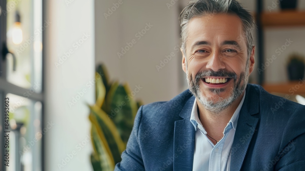 Picture of a confident mature businessman smiling while talking on video call looking at camera sitting in office, Picture of a confident mature businessman smiling while talking on video call looking at camera sitting in office,