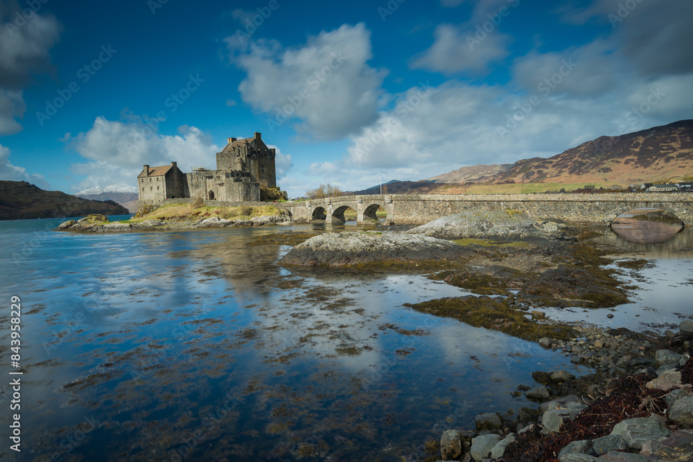 Scottish Castle, Kilchurn Castle, Loch Awe near Oban in the Scottish Highlands. Historic castle reflected in the loch with mountain backdrop. Dramatic lighting on the castle and mountains Scottish Castle, Kilchurn Castle, Loch Awe near Oban in the Scottish Highlands. Historic castle reflected in the loch with mountain backdrop. Dramatic lighting on the castle and mountains
