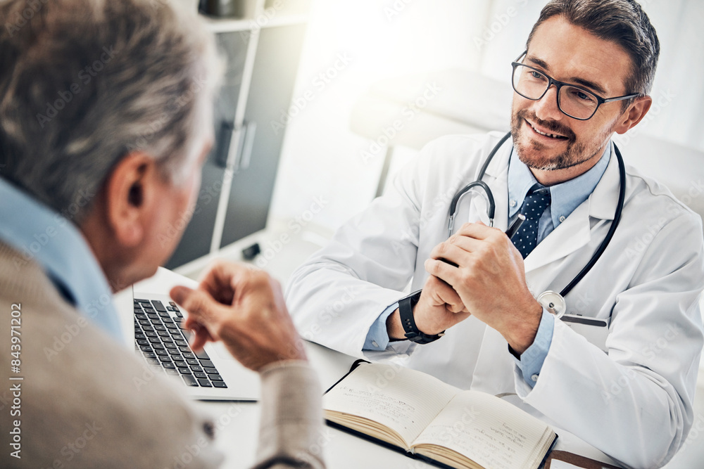 Consultation, man and doctor in office with notes, discussion and advice for health insurance. Clinic, senior patient and medical professional at desk with support, trust and healthcare at checkup Consultation, man and doctor in office with notes, discussion and advice for health insurance. Clinic, senior patient and medical professional at desk with support, trust and healthcare at checkup
