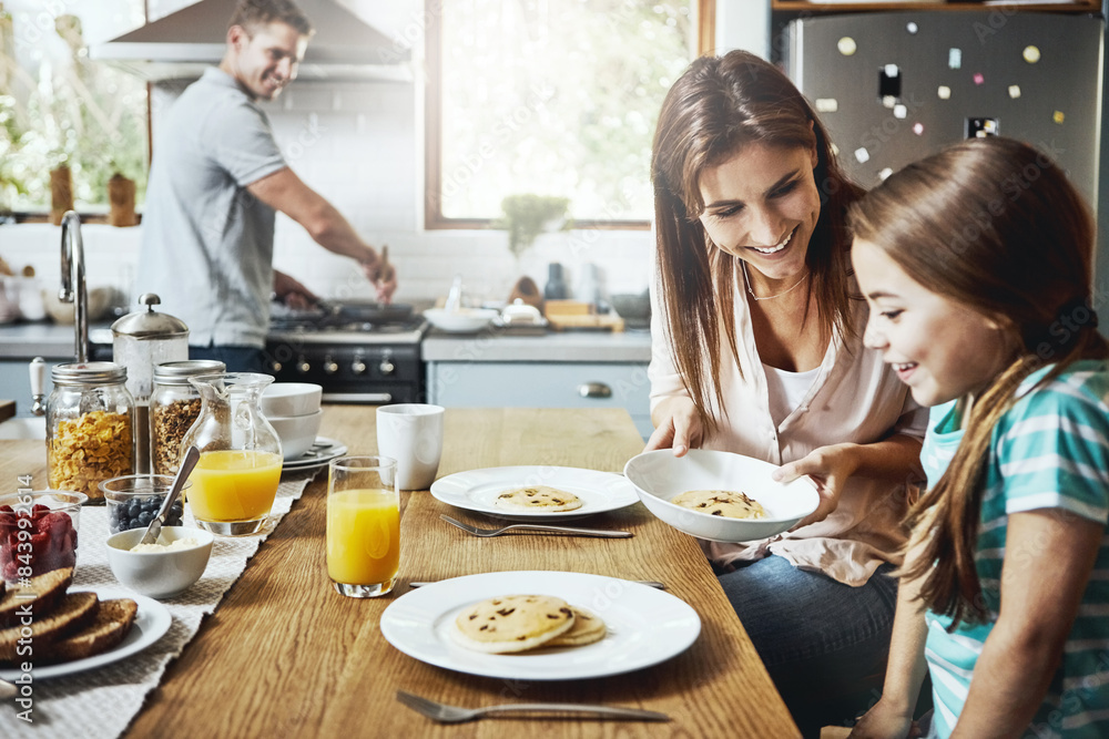 Love, breakfast pancakes and happy family with children, mother and father, bonding and prepare ingredients. Morning food, cooking and hungry woman, man and daughter in home kitchen eating meal Love, breakfast pancakes and happy family with children, mother and father, bonding and prepare ingredients. Morning food, cooking and hungry woman, man and daughter in home kitchen eating meal