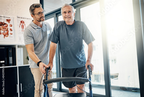 Physiotherapy, walking frame and old man for consulting, rehabilitation or recovery. Healthcare, physical therapy and therapist with senior patient for medical service, wellness or disability support