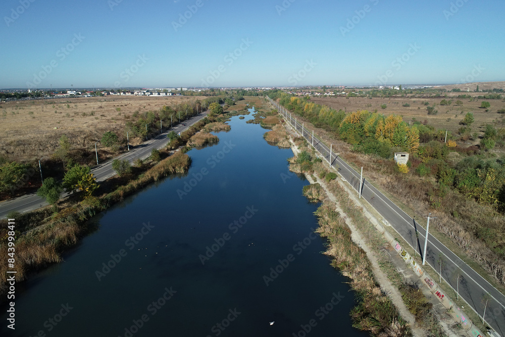 Aerial picture over Dambovita river nearby Bucharest city in a beautiful morning in autumn season.
Aerial picture over Dambovita river nearby Bucharest city in a beautiful morning in autumn season.