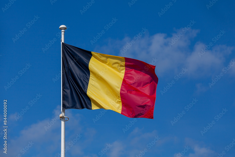 Belgium flag waving atop of its pole Belgium flag waving atop of its pole