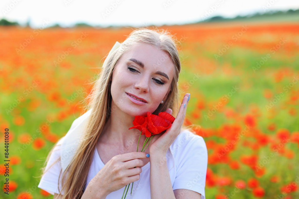 portrait of romantic girl in a white dress in a field with red poppies portrait of romantic girl in a white dress in a field with red poppies