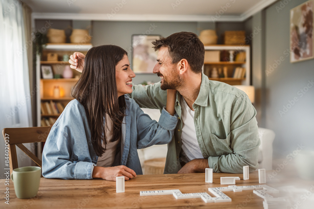 boyfriend and girlfriend play dominoes at home have fun together boyfriend and girlfriend play dominoes at home have fun together