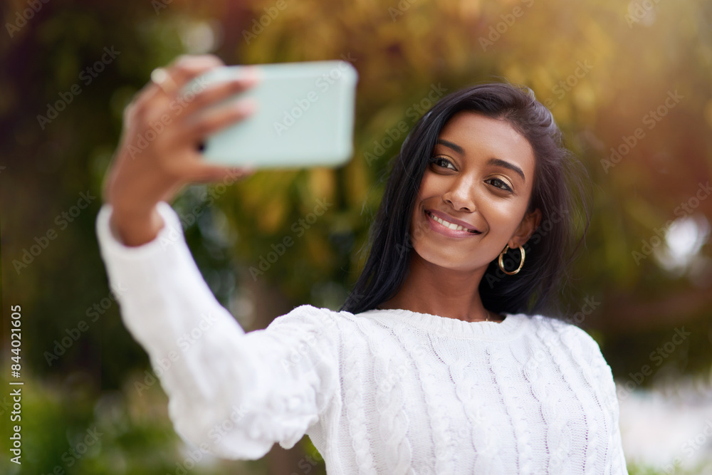 Outdoor, smile and Indian woman in park, selfie and nature of sun, city and relax in weekend. Fashion, eco friendly and confidence for photography, happiness and bokeh for student or memory of person Outdoor, smile and Indian woman in park, selfie and nature of sun, city and relax in weekend. Fashion, eco friendly and confidence for photography, happiness and bokeh for student or memory of person