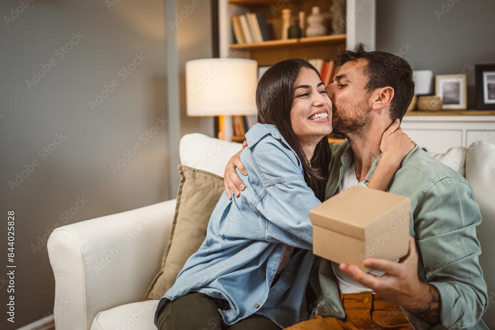 Boyfriend open his birthday present from his girlfriend at home Boyfriend open his birthday present from his girlfriend at home