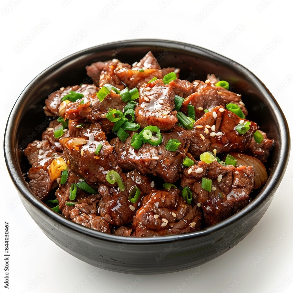 Close Up of Teriyaki Beef With Sesame Seeds and Green Onions in a Black Bowl Close Up of Teriyaki Beef With Sesame Seeds and Green Onions in a Black Bowl