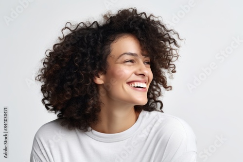 Portrait of a happy young african american woman with curly hair