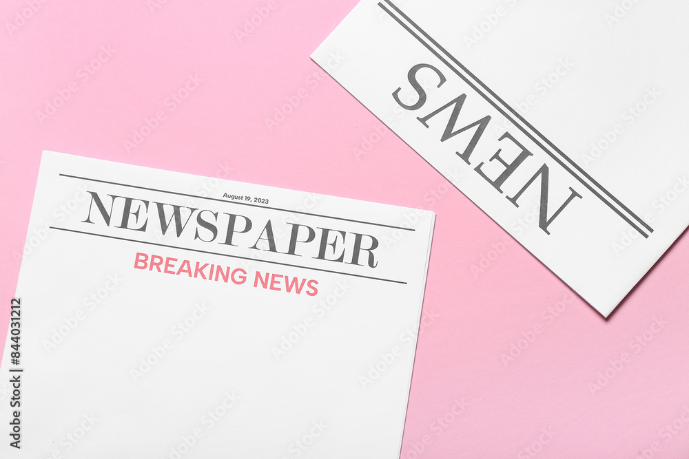 Blank newspapers on pink background Blank newspapers on pink background
