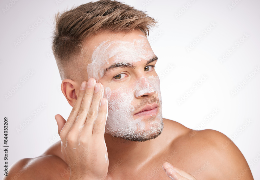 Beauty, skincare or man with face wash in studio for facial treatment, grooming or dermatology on white background. Wellness, cosmetic and model for healthy pores, morning routine or mask product Beauty, skincare or man with face wash in studio for facial treatment, grooming or dermatology on white background. Wellness, cosmetic and model for healthy pores, morning routine or mask product