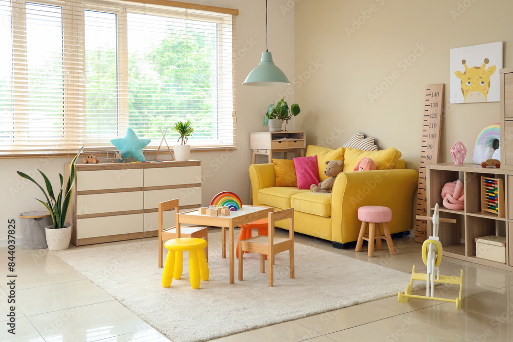 Interior of modern playroom with toys and rocking horse in kindergarten Interior of modern playroom with toys and rocking horse in kindergarten