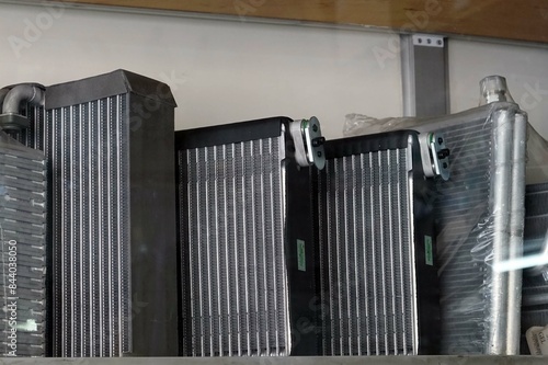 A lot of an new evaportor coil on on the shelf in the car air shope.