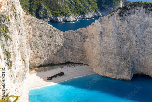 Fototapeta Naklejka Na Ścianę i Meble -  Beautiful view of a deserted beach with a sunken ship.