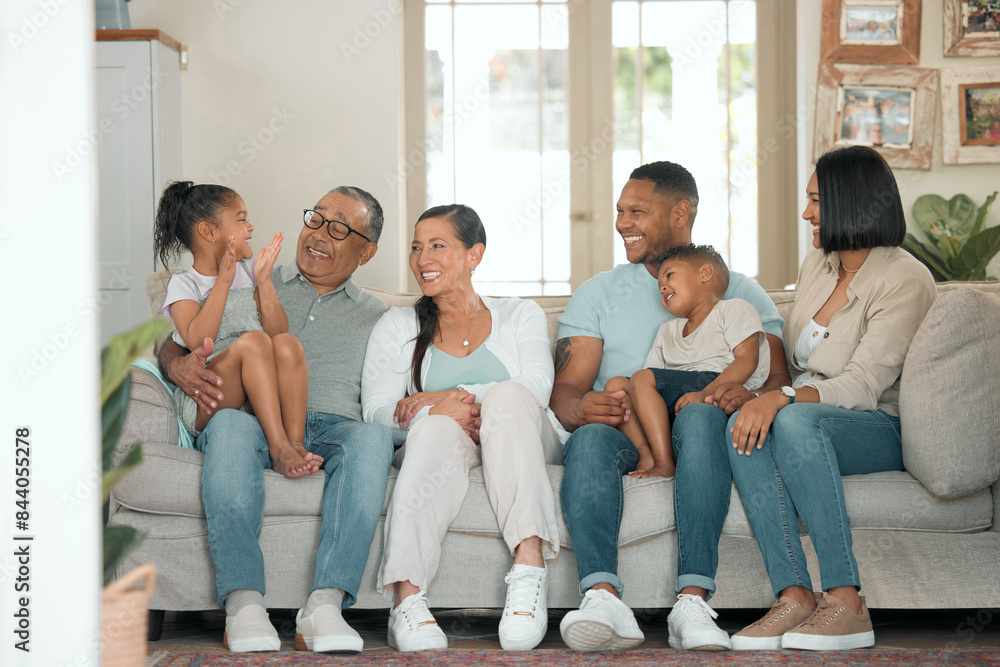 Happy family, relax and together for reunion on sofa in living room for gathering, children and love. Support, celebrate and excited for holiday or vacation in home with kid and parents on couch Happy family, relax and together for reunion on sofa in living room for gathering, children and love. Support, celebrate and excited for holiday or vacation in home with kid and parents on couch