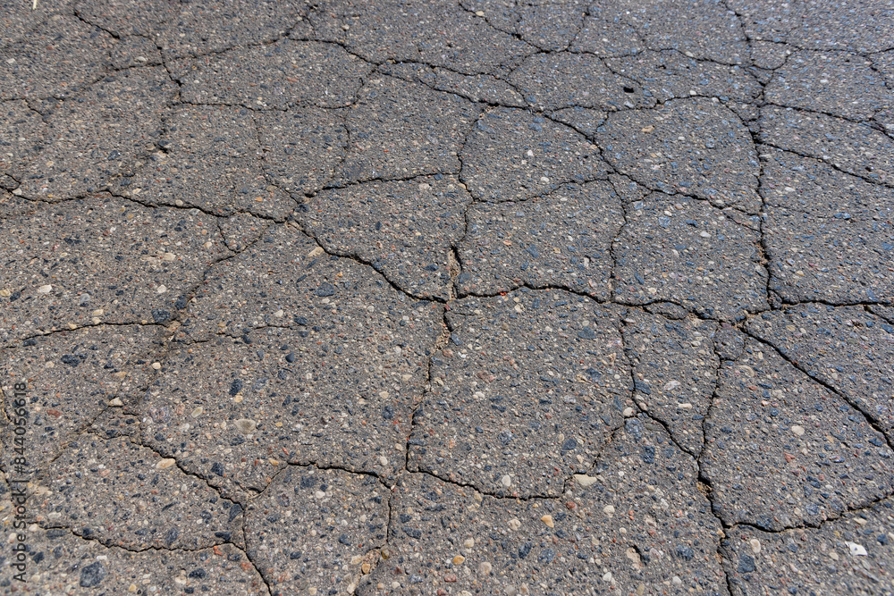 Obraz premium a part of a highway covered with cracked asphalt