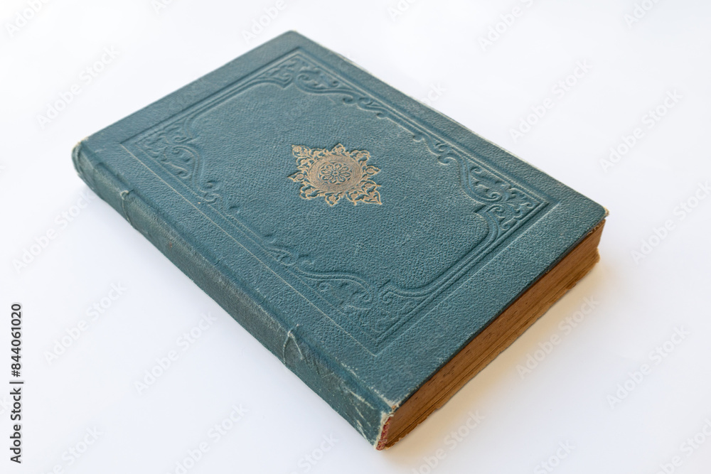 green coloured damaged cover of a very old book. yellowed natural paper texture. isolated on white background. clean close-up. green coloured damaged cover of a very old book. yellowed natural paper texture. isolated on white background. clean close-up.