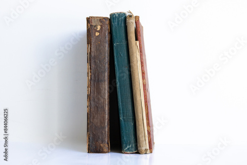 Obraz na plátně old damaged books lined up side by side