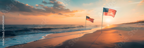 A serene beach at sunrise with American flags gently waving in the breeze on a warm summer morning 