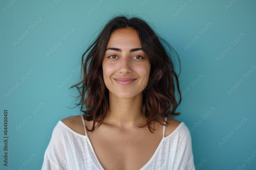 Fototapeta premium A close up portrait of a young woman with a subtle smile