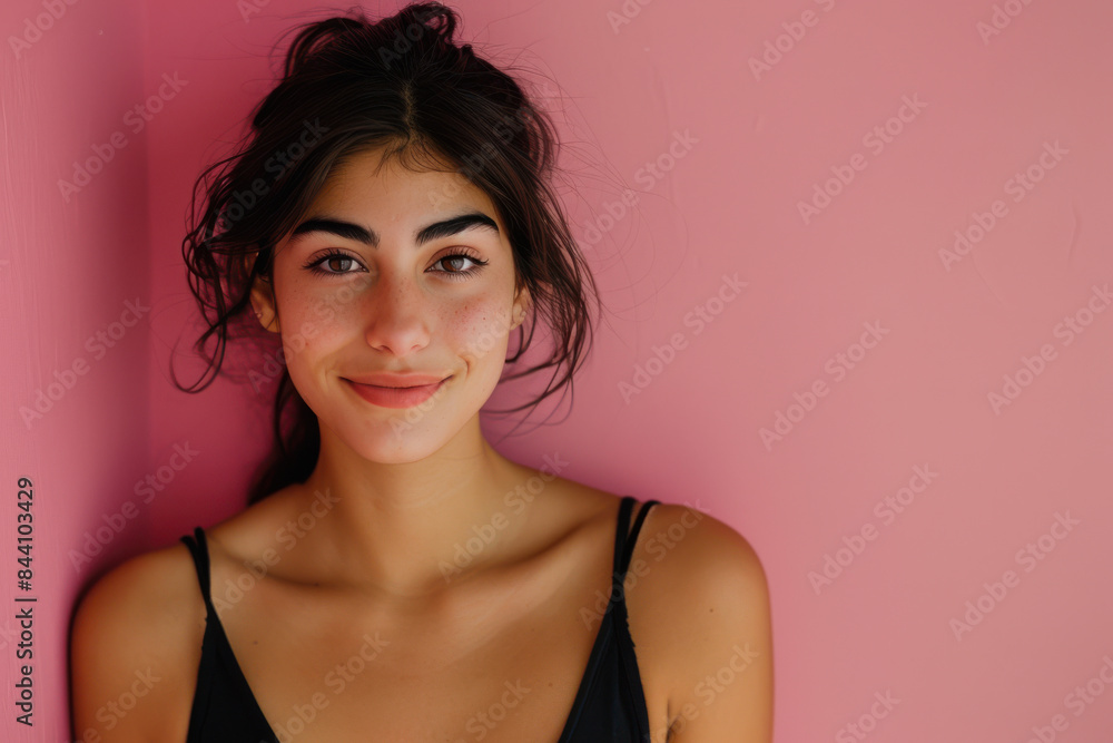 A close up portrait of a young woman with a subtle smile A close up portrait of a young woman with a subtle smile