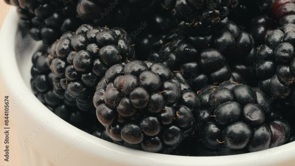 Blackberries in bowl close up and spinning Blackberries in bowl close up and spinning