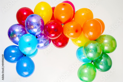 : An arch of vibrant balloons in various colors, designed for a joyful birthday celebration, isolated on a white background. © Ateeq