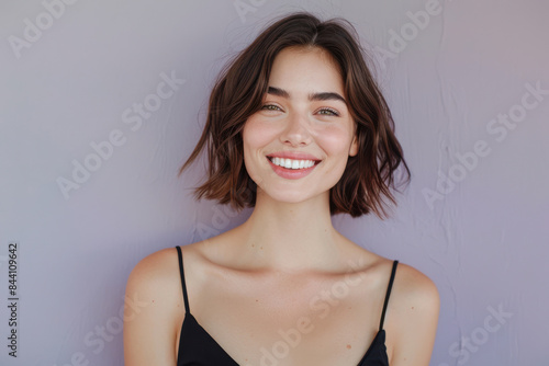 A close up portrait of a young woman with a subtle smile