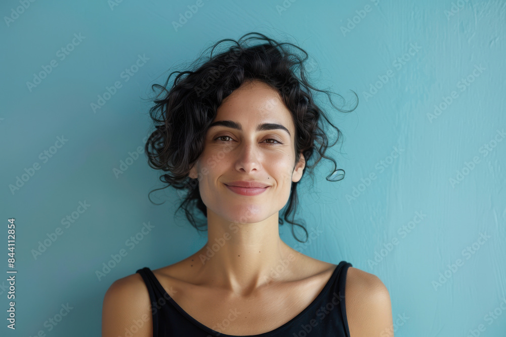A close up portrait of a young woman with a subtle smile A close up portrait of a young woman with a subtle smile