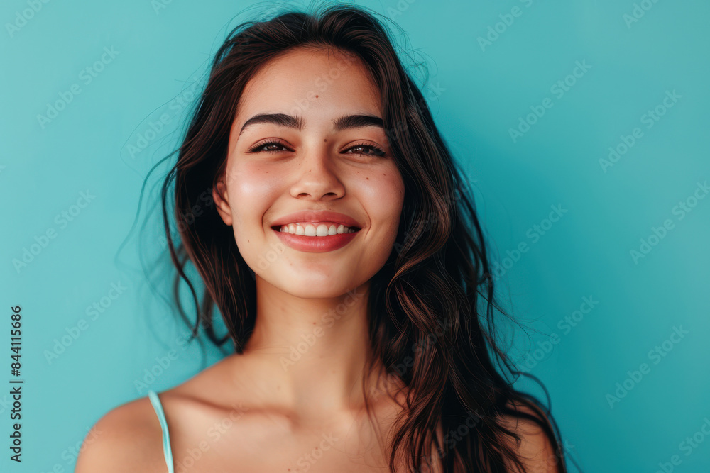 A close up portrait of a young woman with a subtle smile A close up portrait of a young woman with a subtle smile