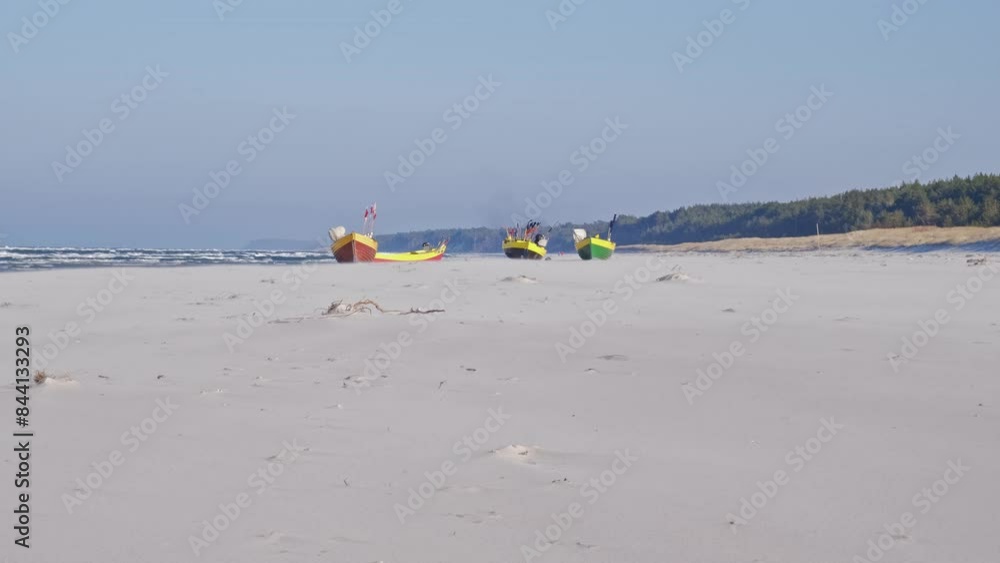Undecked Handliner Fishing Vessel with Net Flags and Rusty Hooks Purse Sein Equipment Parked on Beach Sand at Seashore on Windy Day Undecked Handliner Fishing Vessel with Net Flags and Rusty Hooks Purse Sein Equipment Parked on Beach Sand at Seashore on Windy Day