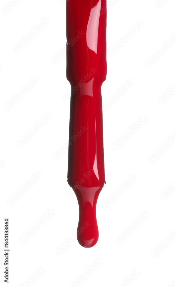 Red nail polish dripping from brush isolated on white Red nail polish dripping from brush isolated on white