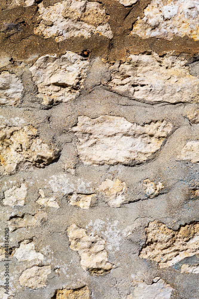 Fototapeta premium Irregular Stone Wall with Mixed Color Bricks
