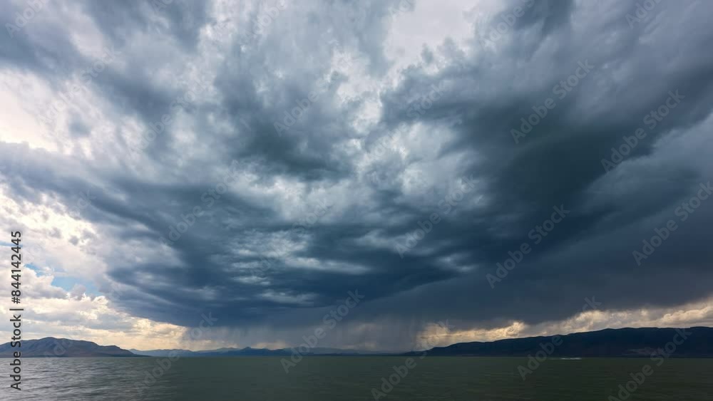 Storm clouds moving over Utah Lake in time lapse during summer monsoon. Storm clouds moving over Utah Lake in time lapse during summer monsoon.
