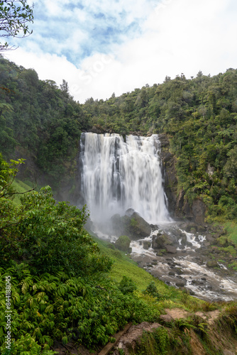 Majestic Marakopa Waterfall in Lush Green Forest 