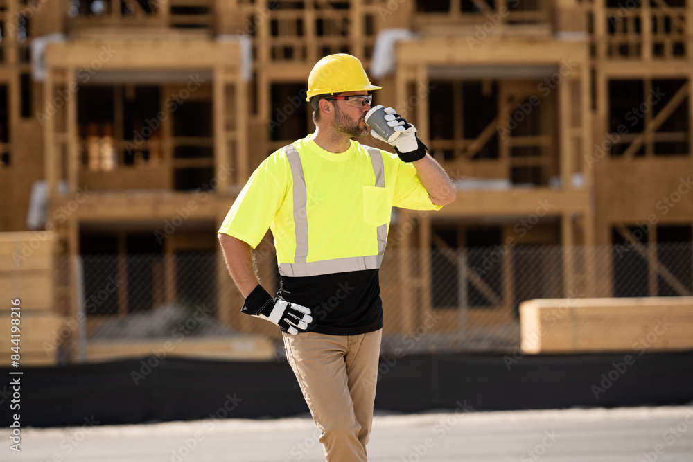 A construction worker in highvisibility gear emphasizes safety and professionalism at a dusty work site