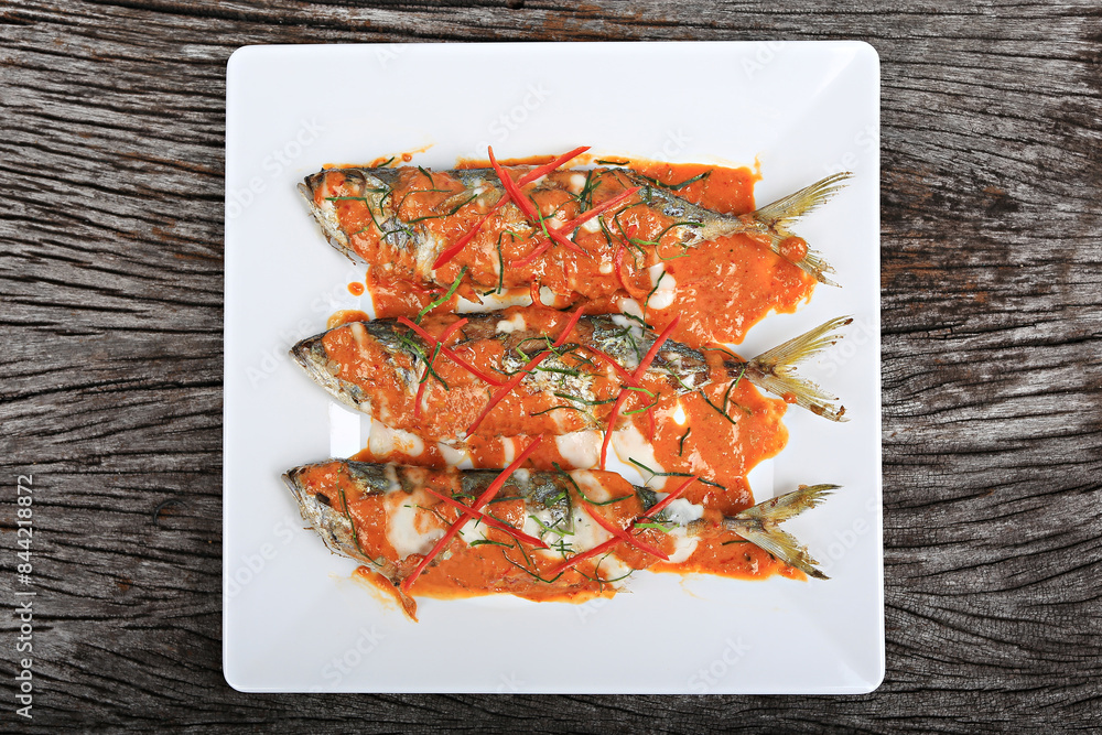Fried mackerel with curry paste or Choo Chee mackerel. Thailand Food Style Background Fried mackerel with curry paste or Choo Chee mackerel. Thailand Food Style Background