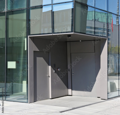 The service entrance to the office building is equipped with a fire hydrant and a video camera