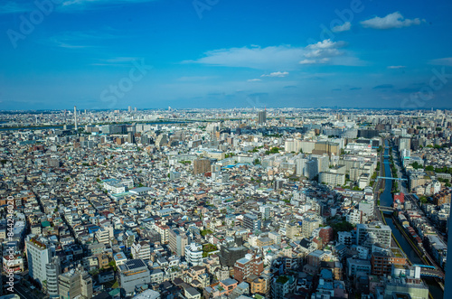 東京スカイツリーの隣の高層ビルからの東京の街並み photo