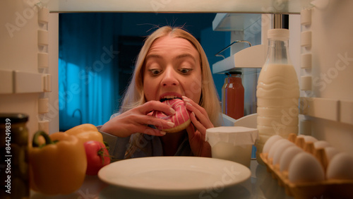 Obraz na płótnie Point of view POV from inside refrigerator hungry Caucasian woman girl at night