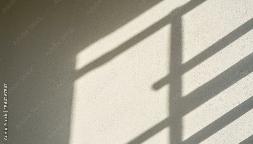 Fototapeta premium Blurry light shadow from window on white wall background