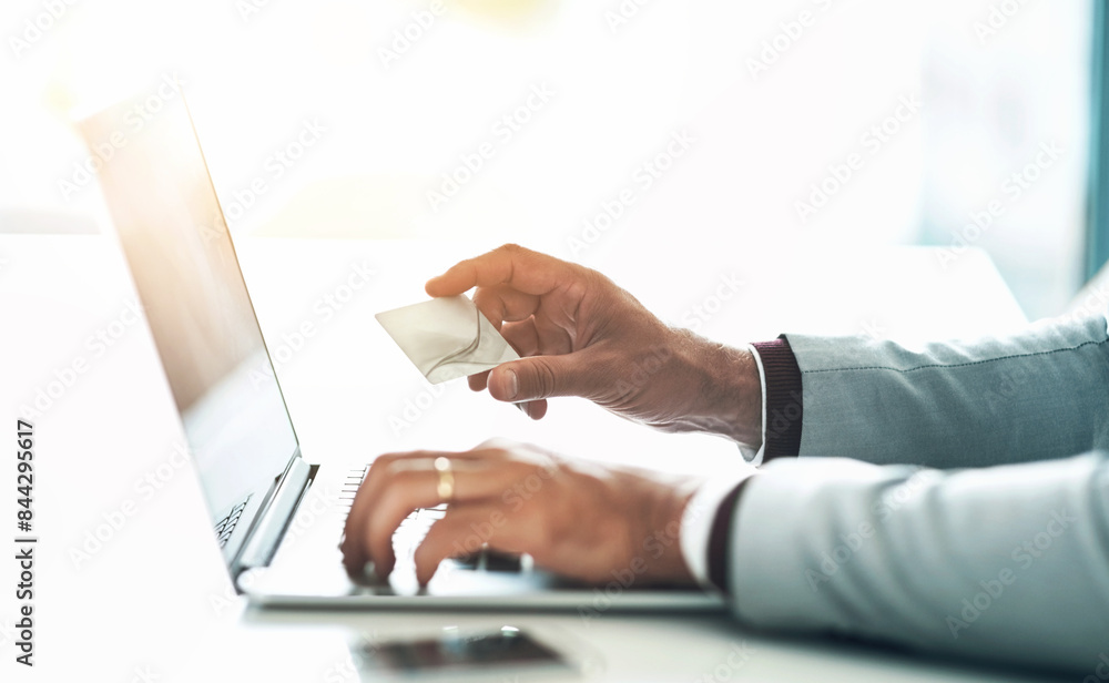 Businessman, hands and credit card with laptop for online shopping, payment and banking investment. Fintech, professional trader and digital finance with typing, loan application and budget in office Businessman, hands and credit card with laptop for online shopping, payment and banking investment. Fintech, professional trader and digital finance with typing, loan application and budget in office